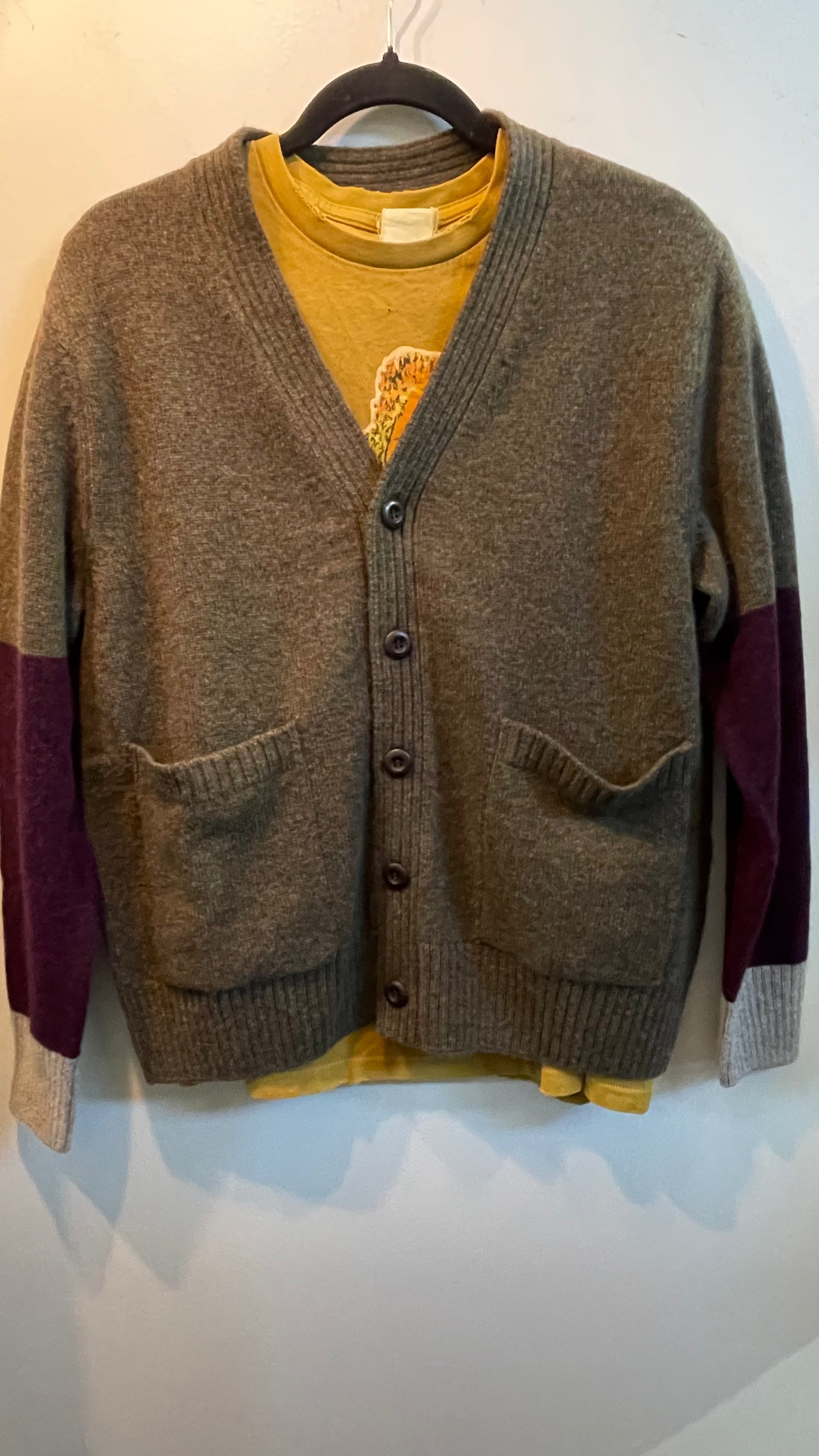 Olive Free City Cashmere Lux Cardigan with purple and grey sleeves worn over a yellow t-shirt.