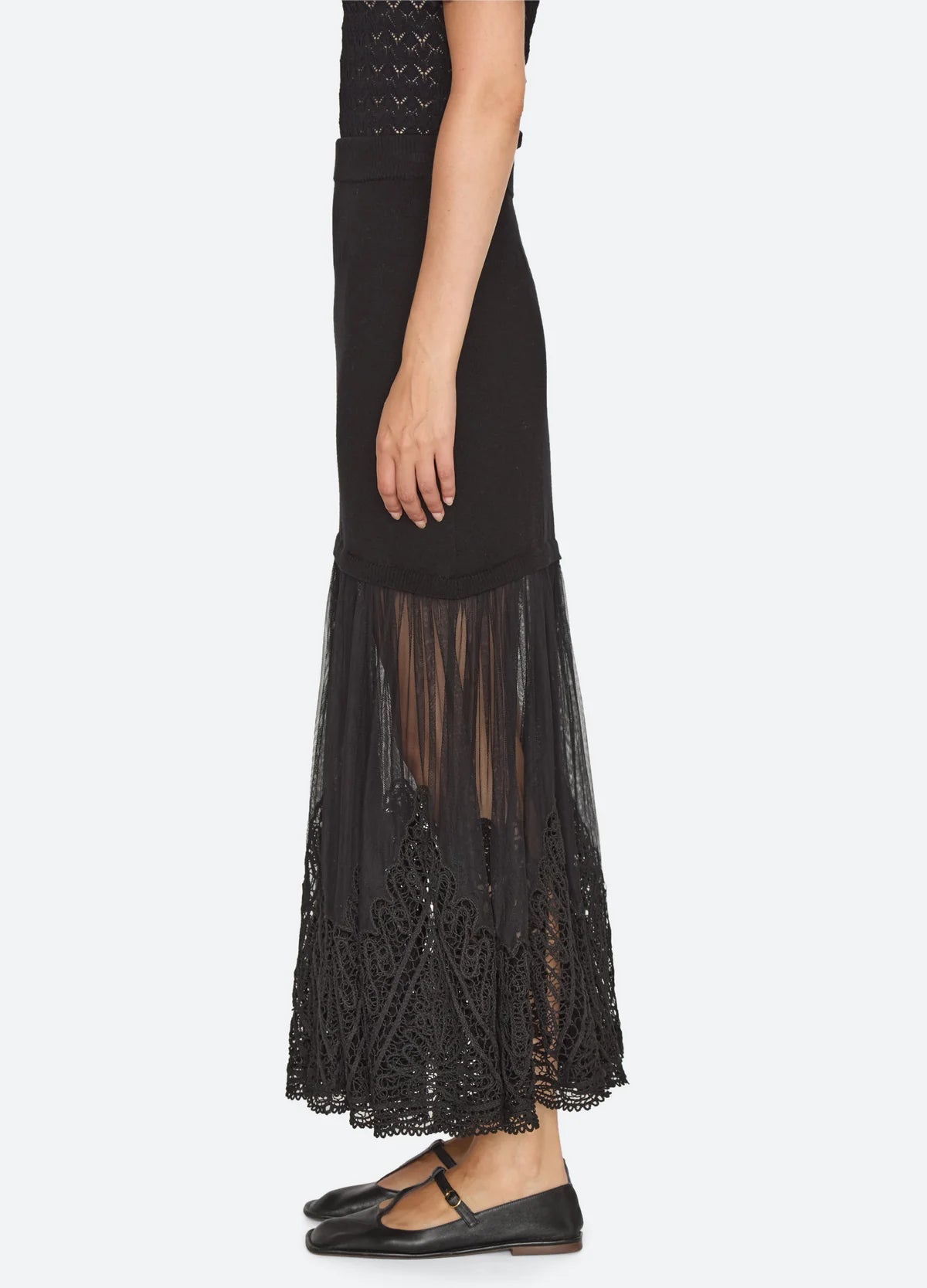 Black Sea New York Vali maxi skirt with high-waisted ribbed knit, sheer tulle panel, and lace hem trim.