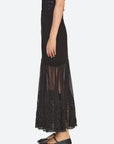 Black Sea New York Vali maxi skirt with high-waisted ribbed knit, sheer tulle panel, and lace hem trim.