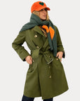 Kerri Rosenthal Color Washed Trench coat styled with an orange hat featuring green heart and green scarf.