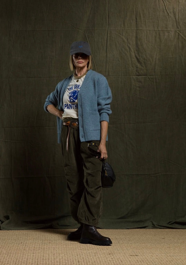 Olive green Cashmereblend Loose Drawcord Biggy Corduroy Pants styled with a blue cardigan and baseball cap.