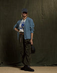 Olive green Cashmereblend Loose Drawcord Biggy Corduroy Pants styled with a blue cardigan and baseball cap.