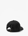 The Clare Vivier Baseball Hat - Comme Ci Comme Ca is a black cotton adjustable cap shown from the back, featuring a sliding metal strap closure against a plain white background. One size ensures a comfortable fit for all.