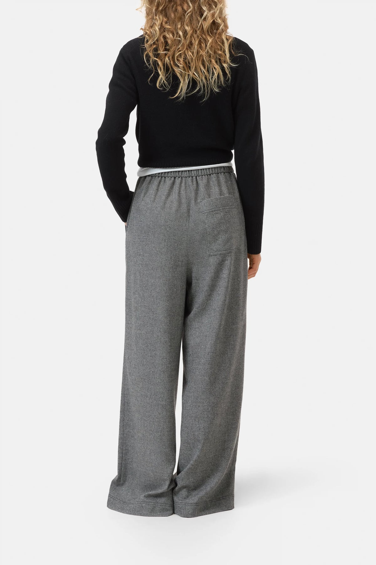 Black CLOSED Wynston long-sleeve top and wide-leg trousers shown from the back against a white background.