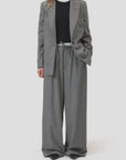 CLOSED Wynston grey flannel twill wide-leg trousers styled with black shoes and layered tops in a modern setting.