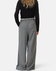 Black CLOSED Wynston long-sleeve top and wide-leg trousers shown from the back against a white background.