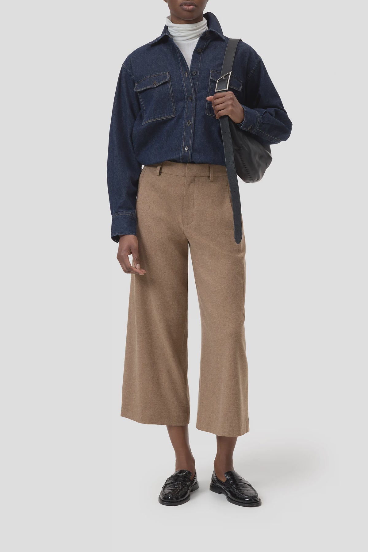 CLOSED Wren tan pants styled with a dark denim shirt and loafers, casual look against a light backdrop.