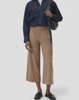 CLOSED Wren tan pants styled with a dark denim shirt and loafers, casual look against a light backdrop.