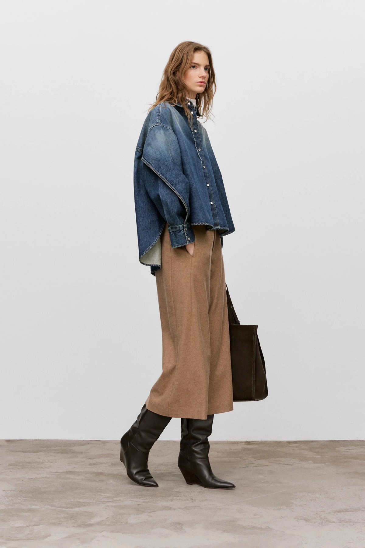 CLOSED Wren Pant styled with a loose denim jacket and black boots, modern casual look against neutral backdrop.