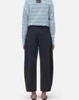 Light blue striped Jazzie shirt and barrel fit organic denim jeans by CLOSED, shown barefoot in a casual setting.