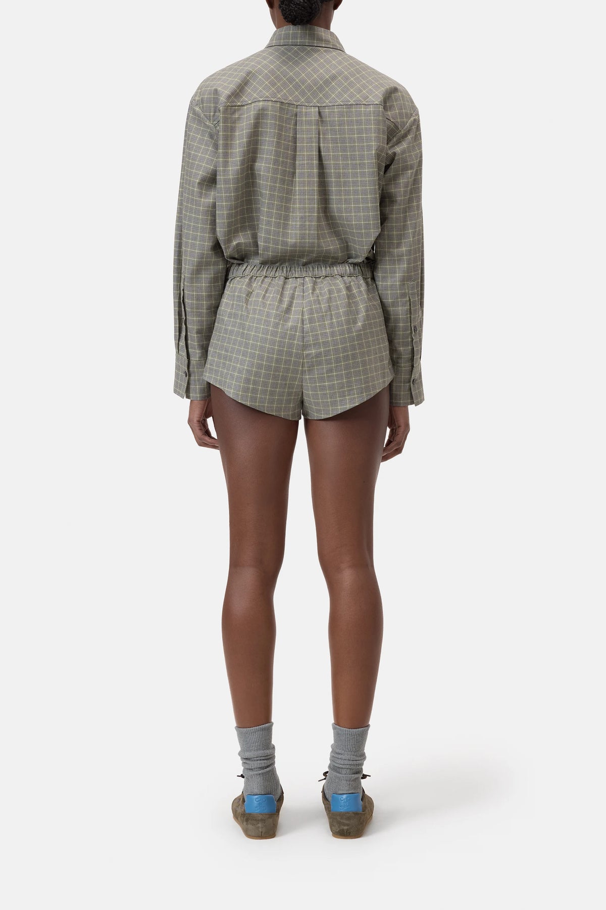CLOSED Boxer Pantie styled with a relaxed plaid shirt, gray socks, and blue-heeled sandals in a casual setting.