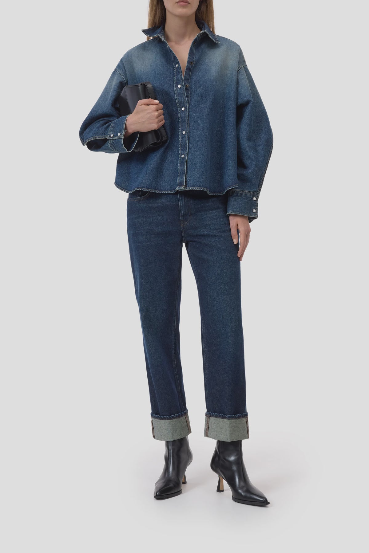CLOSED Overlay Detail Shirt with jeans and black boots, styled for a modern look against a simple backdrop.