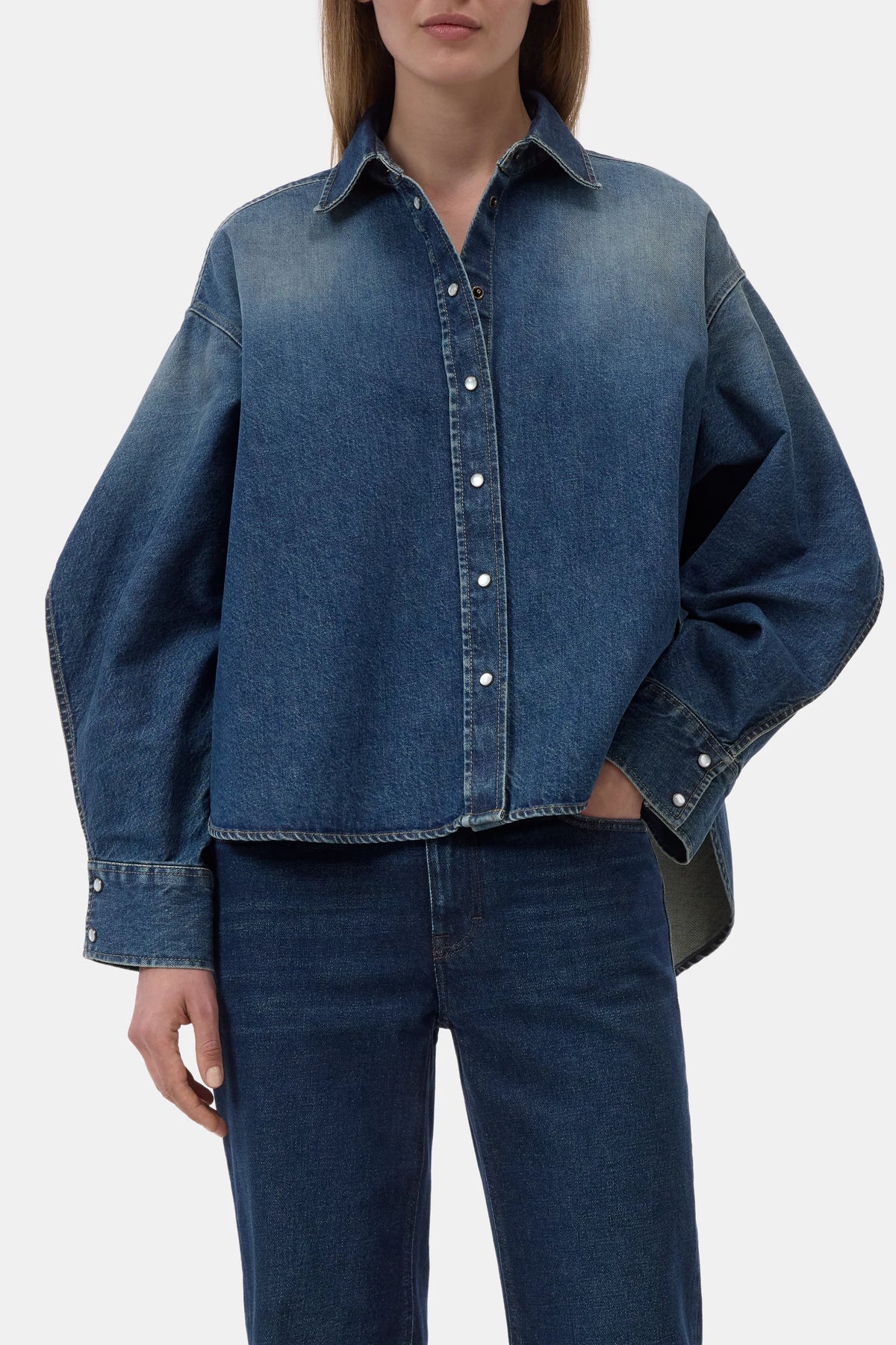 CLOSED Overlay Detail Shirt with matching jeans, light wash denim, casual style, one hand in pocket.