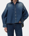 CLOSED Overlay Detail Shirt with matching jeans, light wash denim, casual style, one hand in pocket.