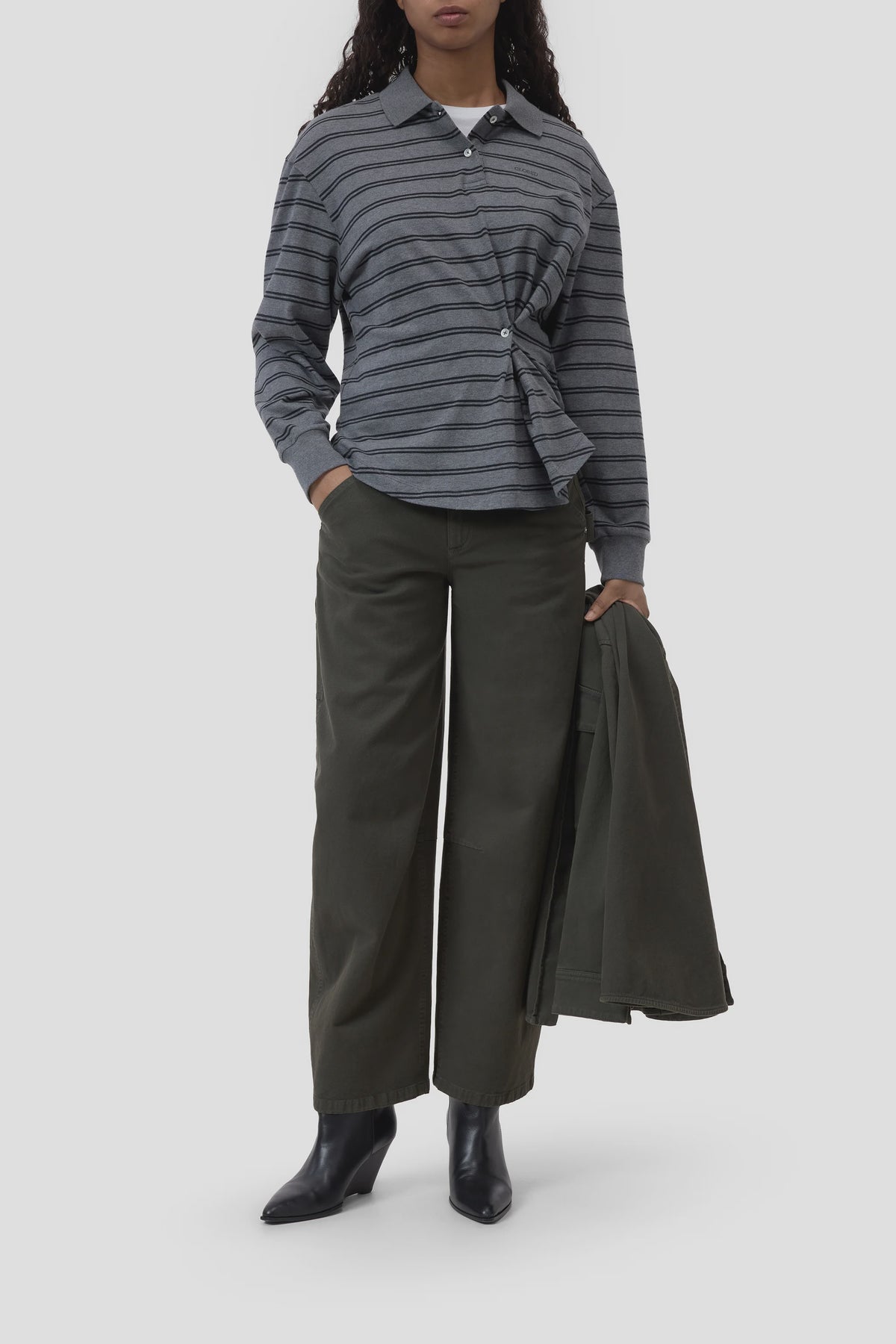 CLOSED olive polo longsleeve with matching jacket, wide-leg pants, and black boots for a modern casual look.