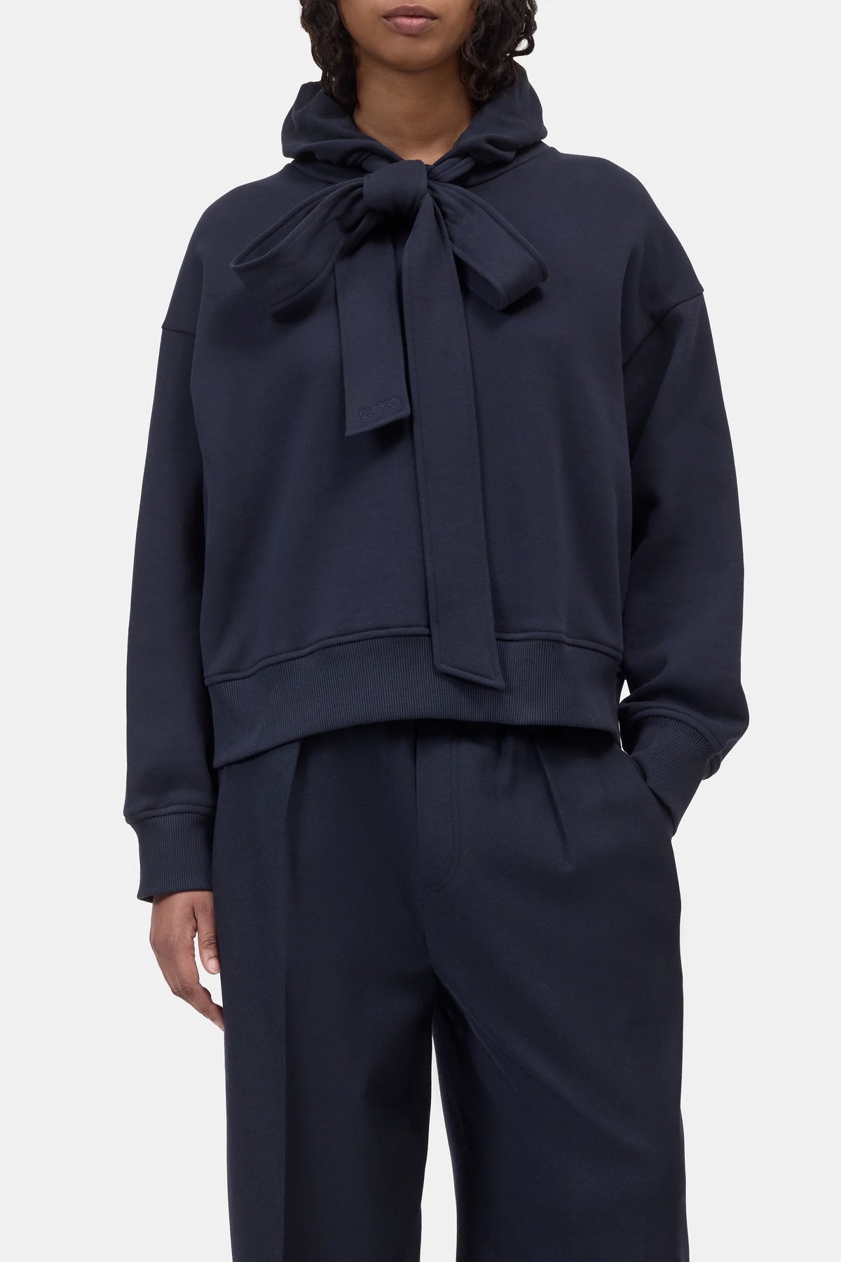 Navy CLOSED Bow Tie Hoodie and wide-leg pants set, featuring a relaxed fit with statement neck bow.