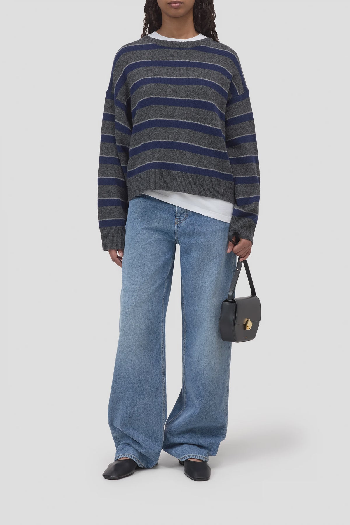 CLOSED striped crew neck sweater with wide-leg jeans and black accessories, modern casual style.