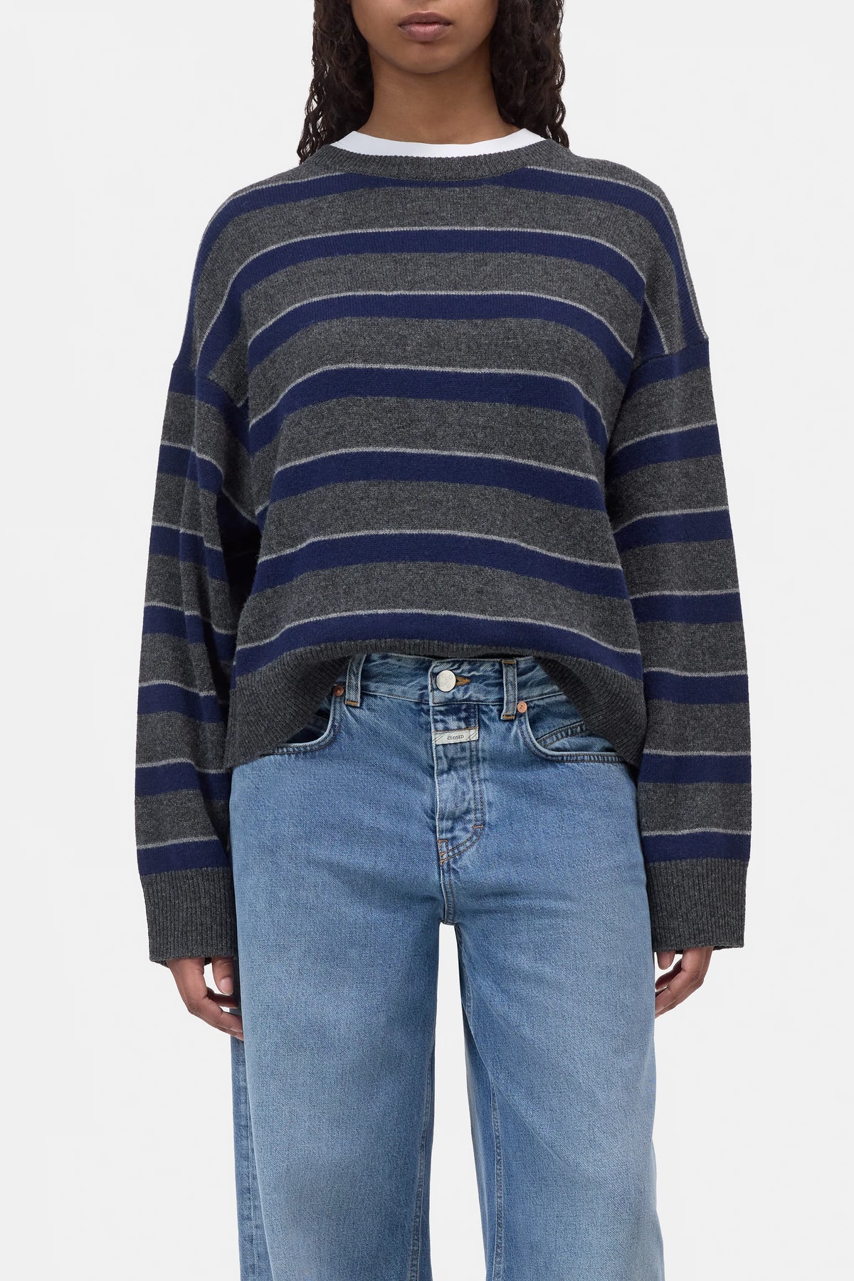 CLOSED striped crew neck jumper and light blue jeans, casual style, white background, Bungalow Furniture &amp; Accessories.