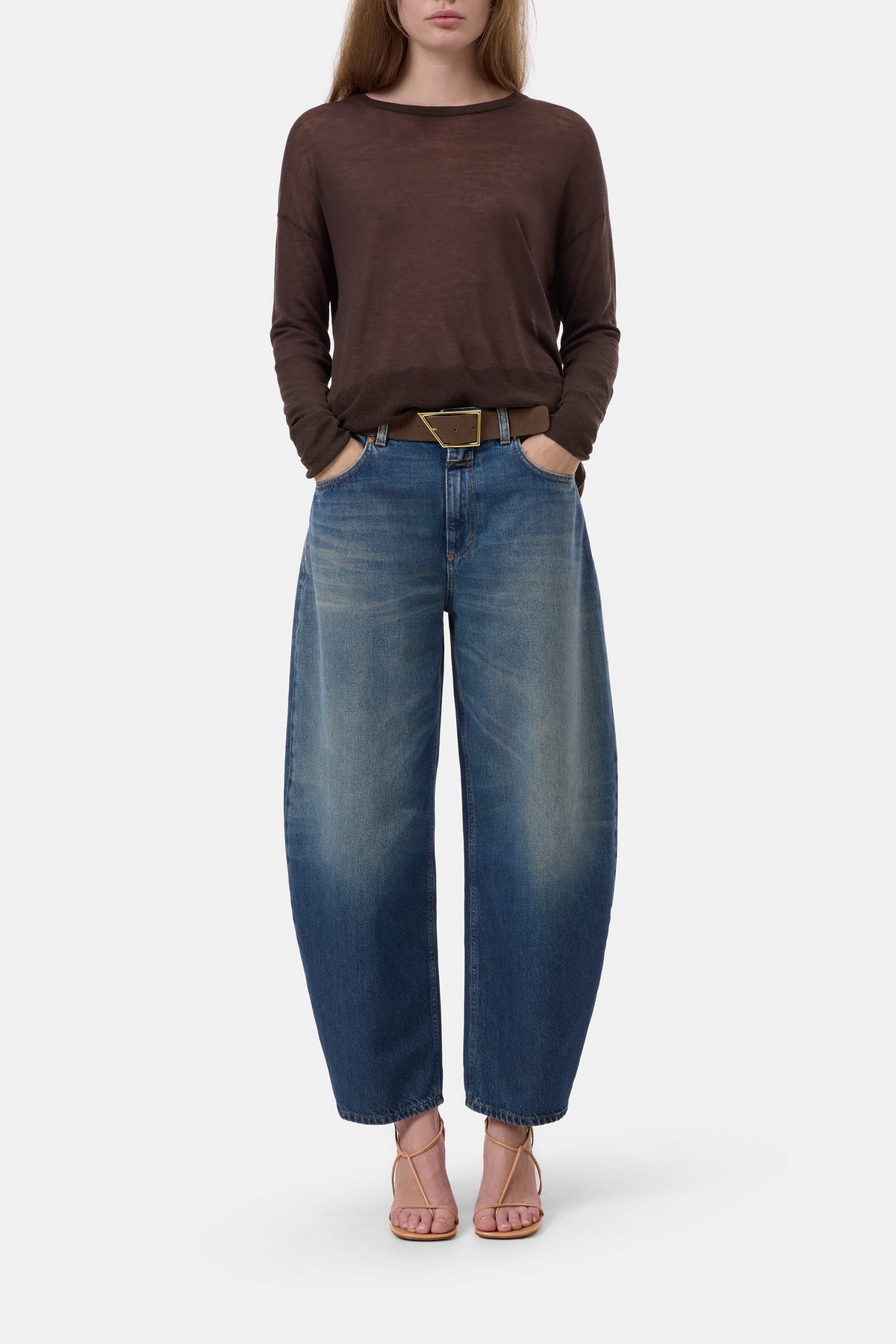 CLOSED crew neck long sleeve top with blue wide-leg jeans and pink sandals, casual modern style.