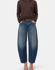 CLOSED crew neck long sleeve top with blue wide-leg jeans and pink sandals, casual modern style.