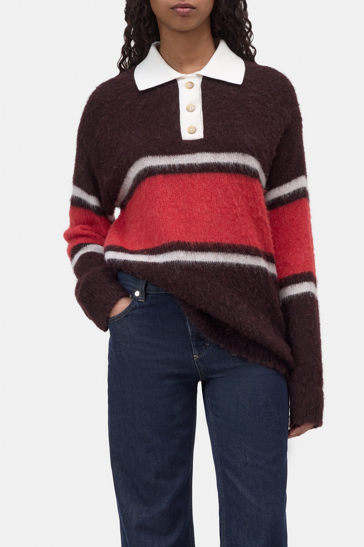 CLOSED Polo with rugby stripes styled with blue jeans and a white shirt for a fresh, modern color-blocked look.
