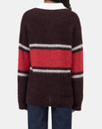 CLOSED rugby stripe polo shirt in multicolor, seen from behind, paired with blue jeans.