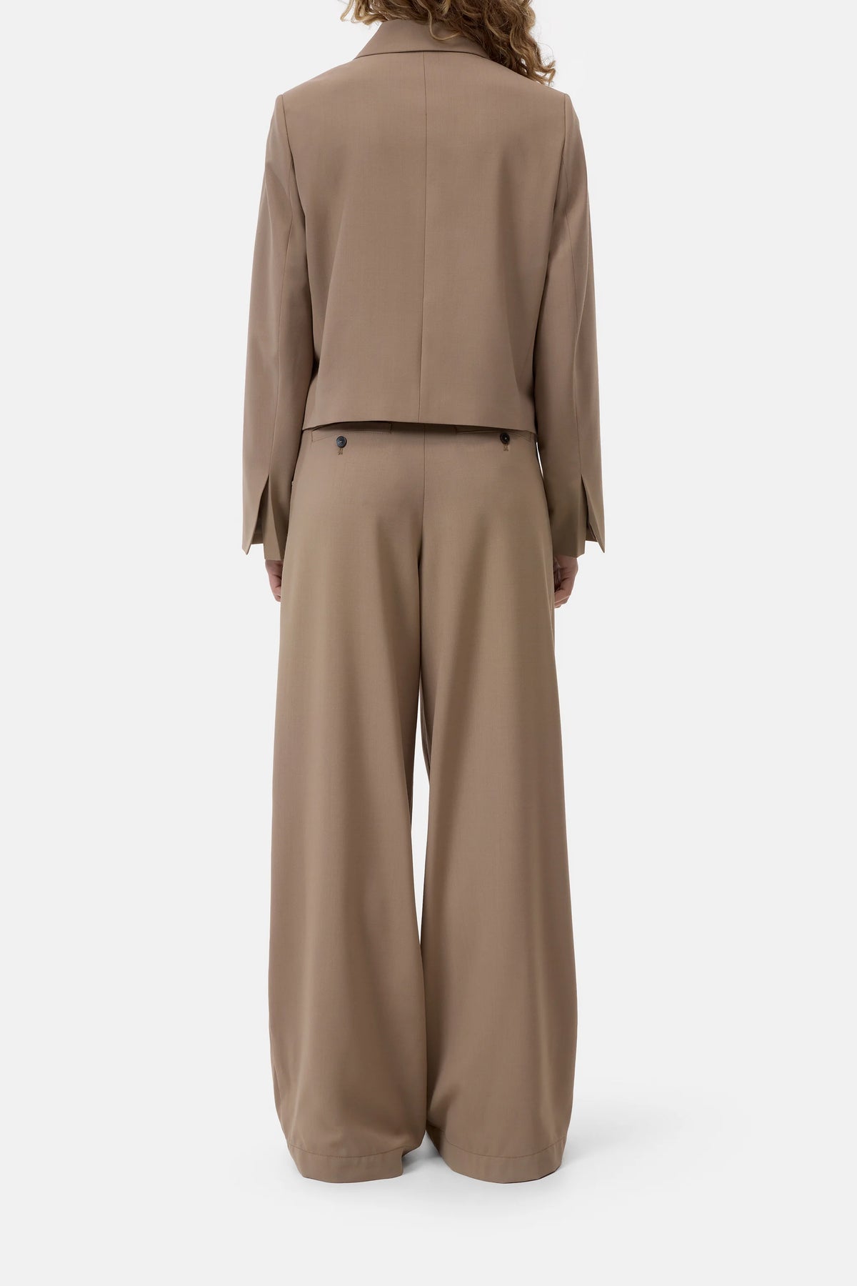 CLOSED tan cropped blazer shown from the back, modern style, perfect for casual or office looks.