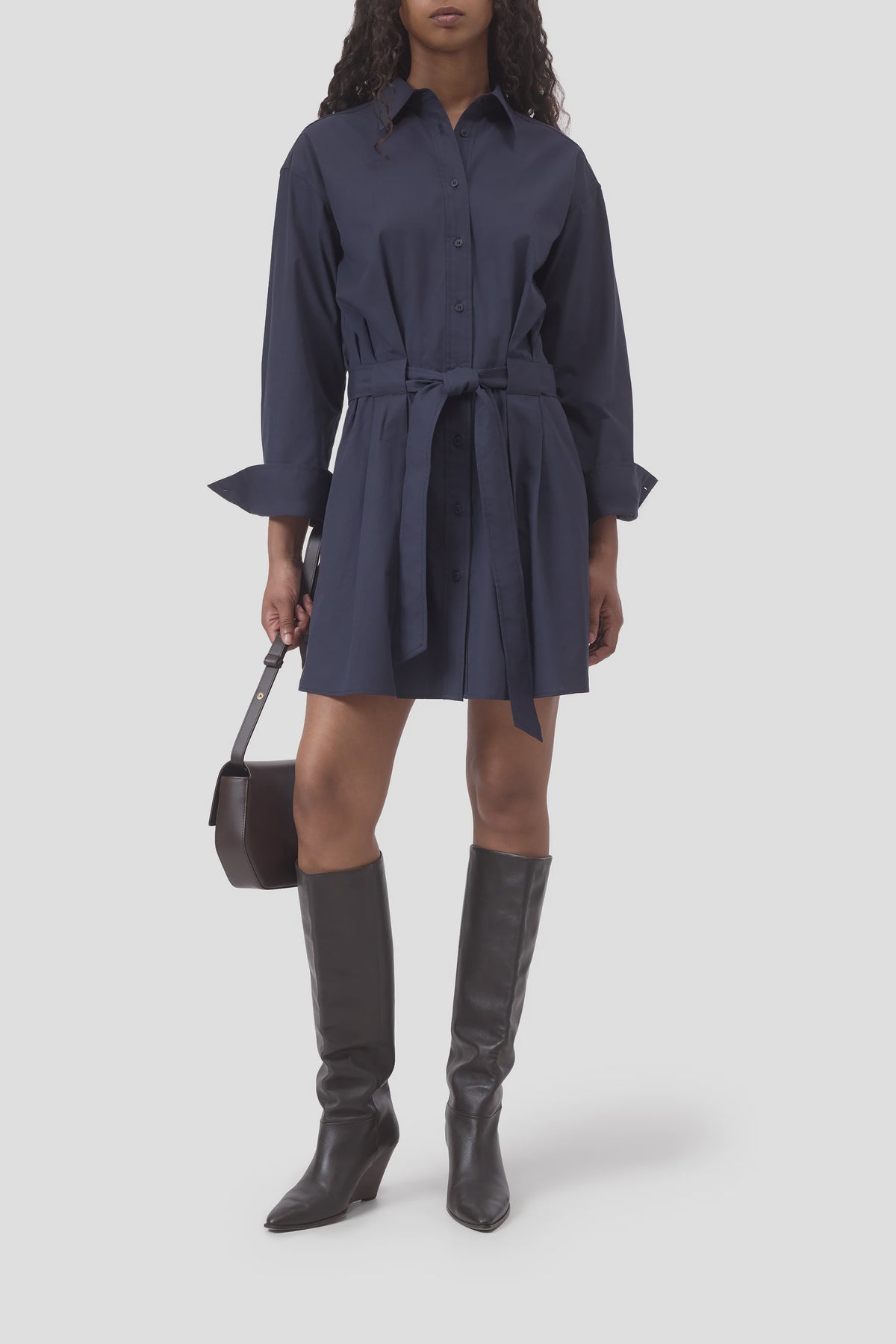 CLOSED organic cotton shirt dress in black styled with knee-high boots and a small black handbag, modern look.
