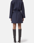 Navy belted shirt dress by CLOSED, back view, styled with knee-high black boots on white background.