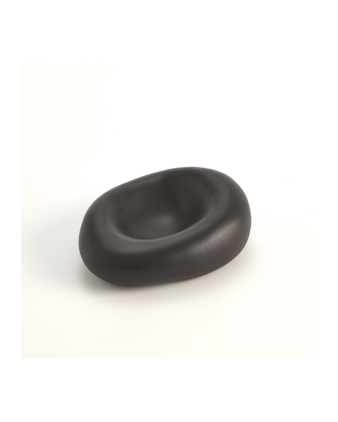 The Balloon Bowl Black S by Global Views is a smooth, matte black oval bowl with a central indentation, resembling Italian-crafted ceramics or abstract sculpture, set against a plain white background.