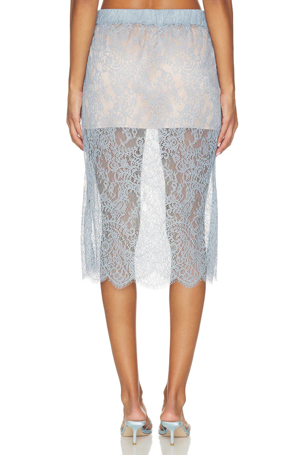 The PENCIL Skirt in light blue lace with an elastic waistband, styled with matching low-heeled sandals by Bungalow.
