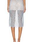 The PENCIL Skirt in light blue lace with an elastic waistband, styled with matching low-heeled sandals by Bungalow.