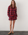 Red plaid MINI Skirt with matching shirt and tan slip-ons by Bungalow Furniture, styled by a white wall.