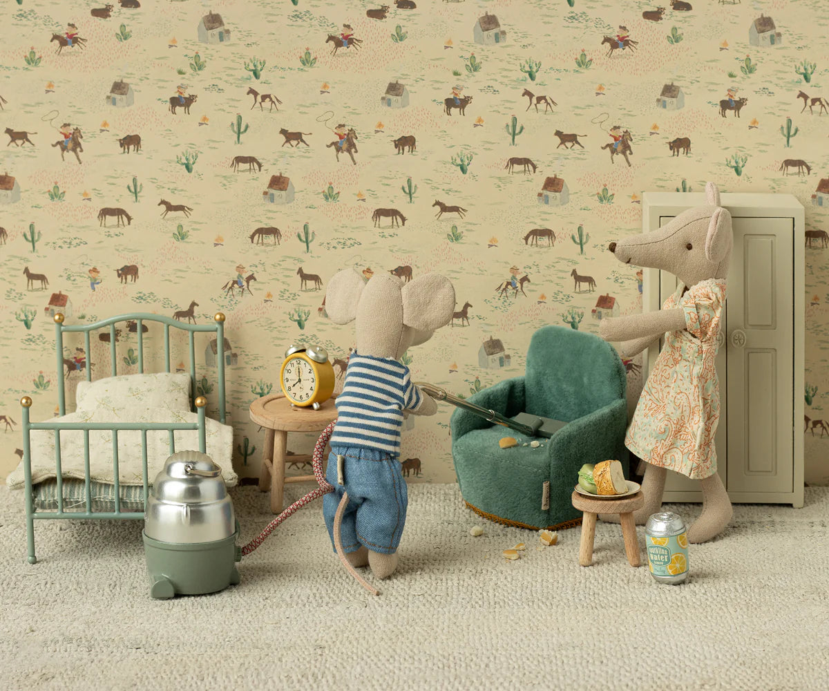 Maileg Folding Chair with Maileg friends, set in a cozy dollhouse room with patterned wallpaper, playful and whimsical style.