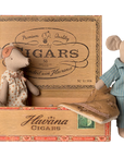 Maileg Mum & Dad Mice in a cigar box bed by Maileg, with Mum in a dress and Dad in striped pajamas, cozy under a blanket.