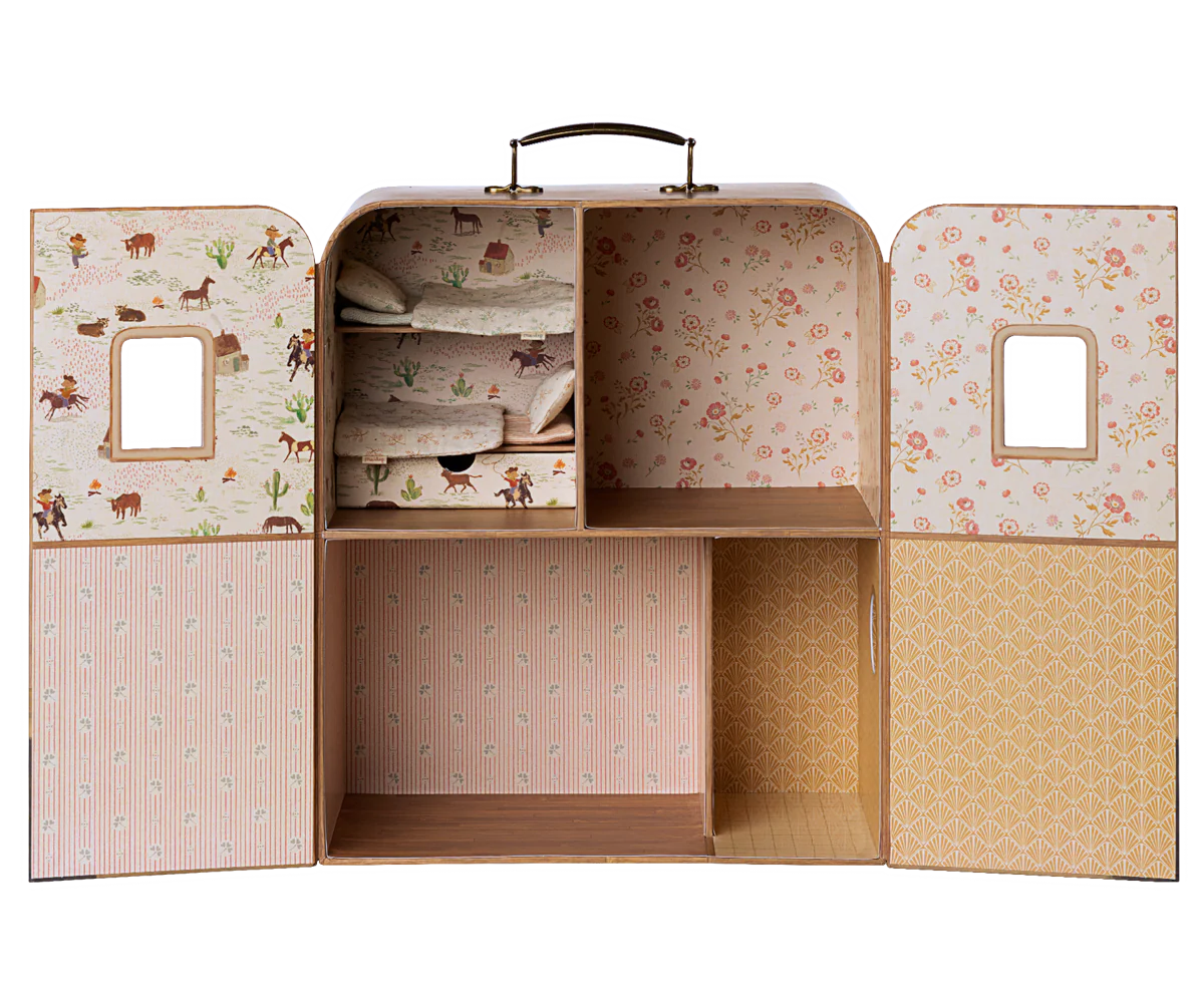 The Maileg SuitCasa Little Sis & Bro by Maileg is a vintage-style doll wardrobe with floral and animal-print wallpaper, shelves, six compartments, a top handle, and windowed doors—ideal for storing toy accessories.