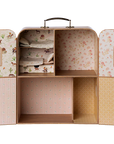The Maileg SuitCasa Little Sis & Bro by Maileg is a vintage-style doll wardrobe with floral and animal-print wallpaper, shelves, six compartments, a top handle, and windowed doors—ideal for storing toy accessories.