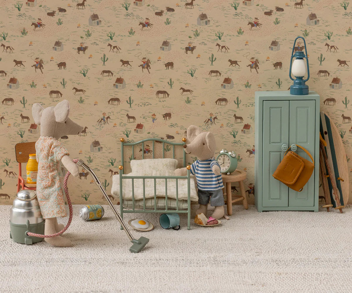 Maileg Vintage Single Bed in a charming dollhouse scene styled with vintage furniture and playful toy mice.