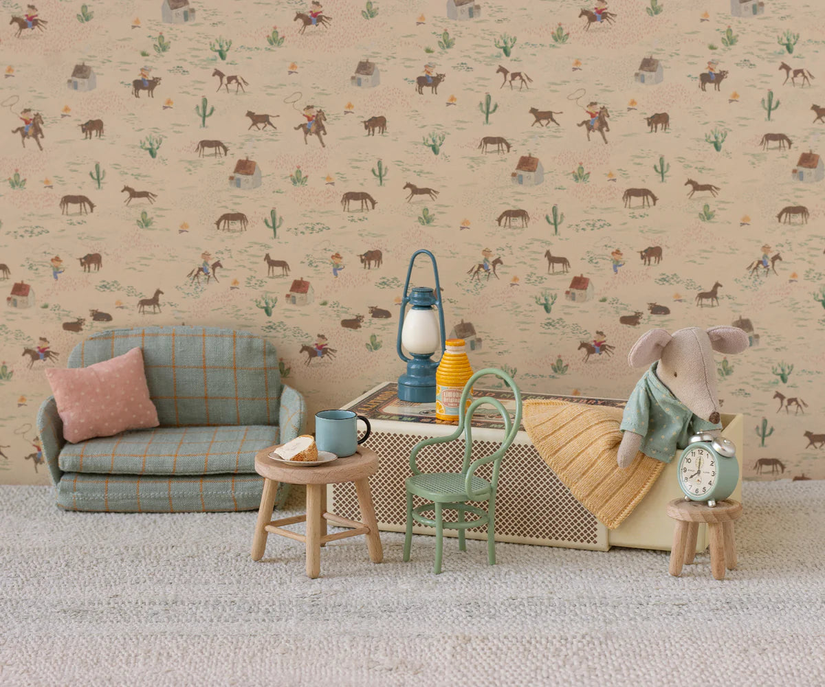 The Maileg Table & Stool by Maileg is the perfect addition to your miniature living room display, ideal for showcasing mouse accessories and fitting seamlessly with western-themed decor and other Maileg furniture pieces.