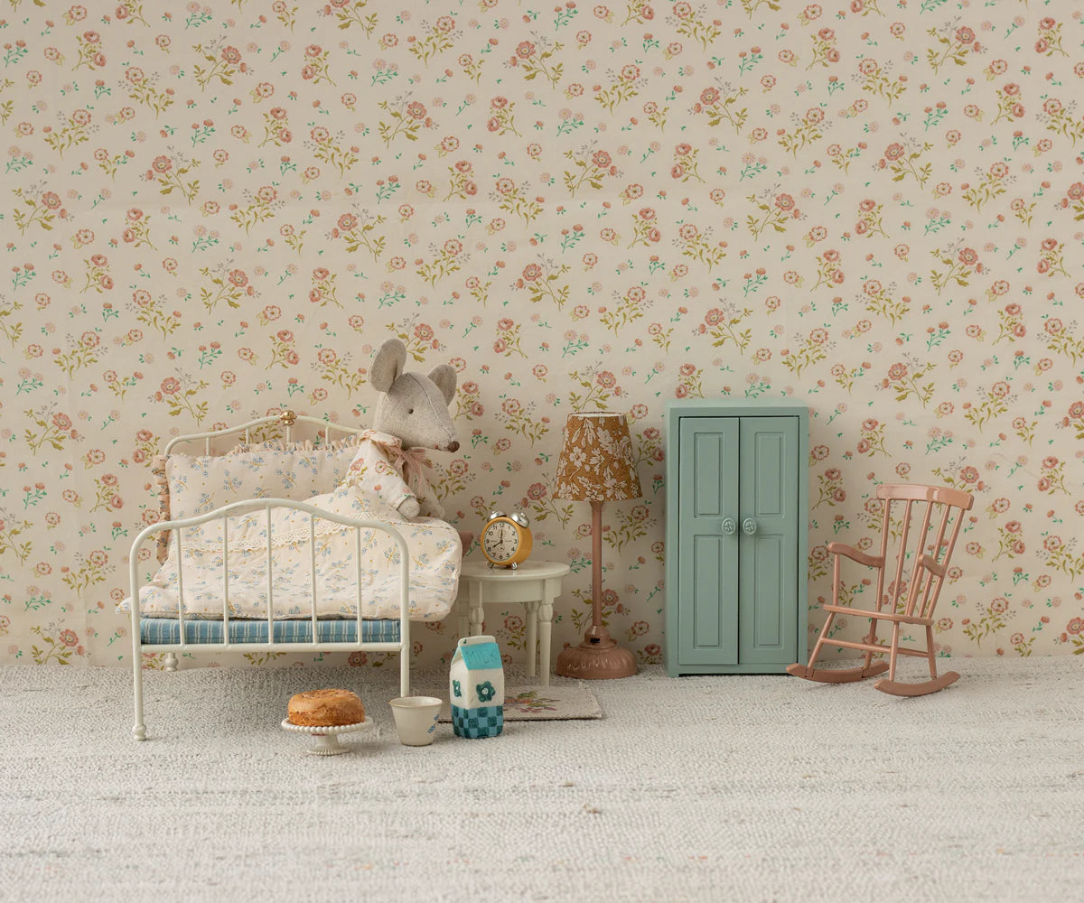 Maileg mouse snuggled in a floral bedroom with cozy decor, vintage toys, and Bungalow Furniture accents.