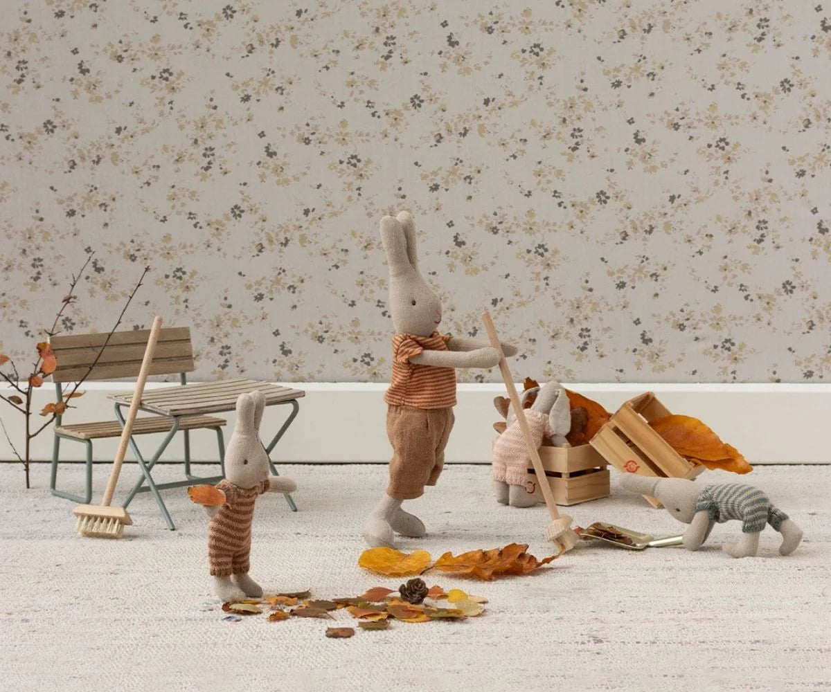 Maileg Broom Set with bunnies in cozy autumn outfits sweeping leaves, styled by Bungalow Furniture & Accessories.