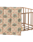 The Maileg Playpen by Maileg is a metal wire storage basket with a quilted, padded lid featuring delicate floral patterns in pastel pink and green, inspired by the charming Maileg playpen design.