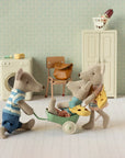 Maileg Little Sister Mouse w/ Bag by Maileg features a dressed toy mouse that can play in a miniature room filled with a washing machine, chair, cabinet, and basket—a charming addition to any imaginative play set.