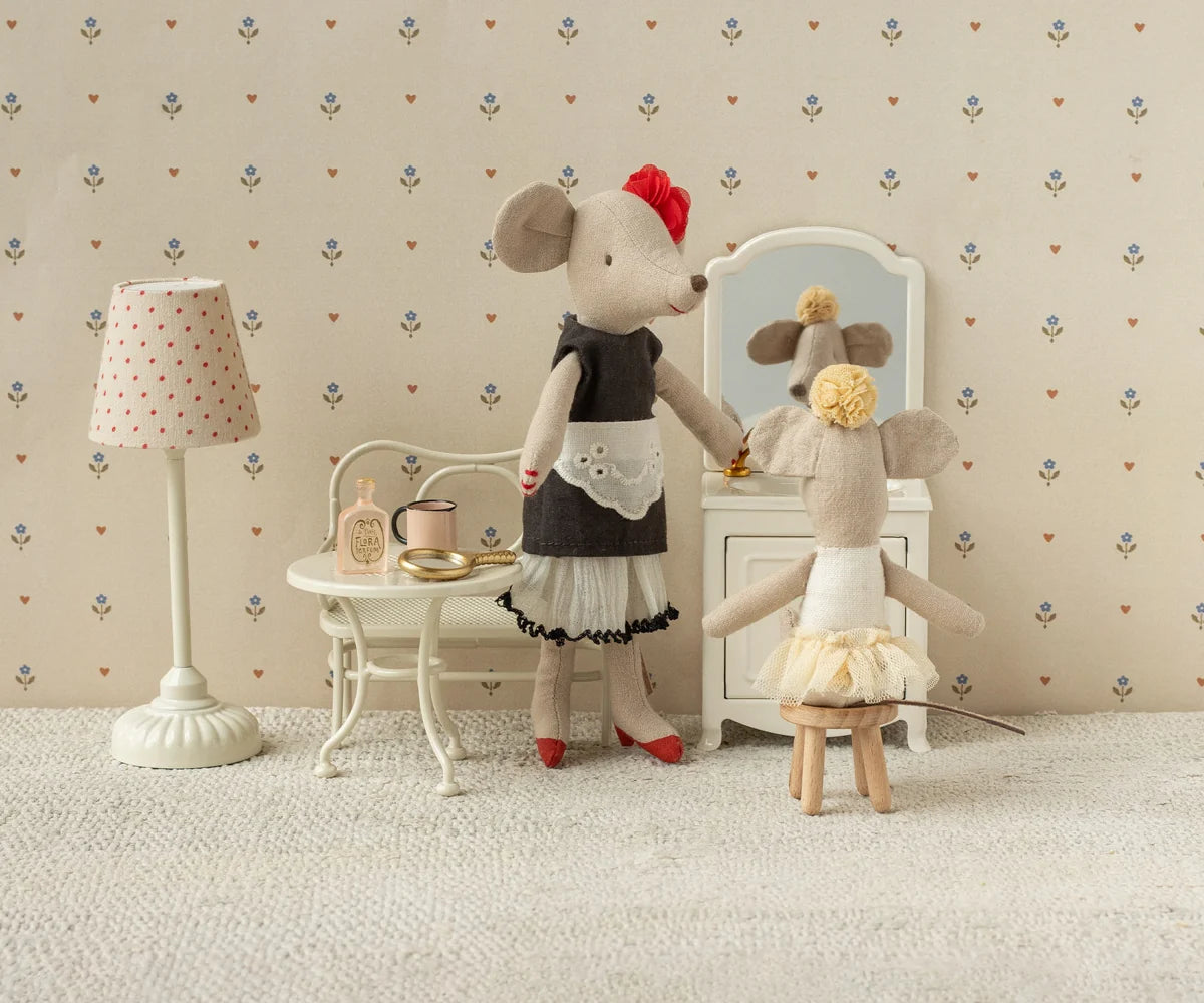 Maileg Beautician Mouse Mum in a dollhouse salon, stylishly dressed and seated at a vanity with magnetic paws.