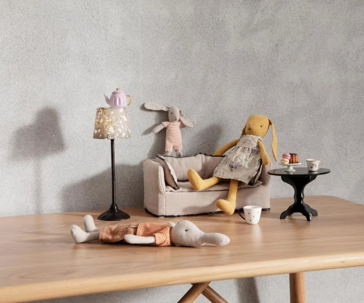 Maileg Coffee Table Miniature styled with toy tea set and plush bunnies, cozy playtime scene by Maileg.