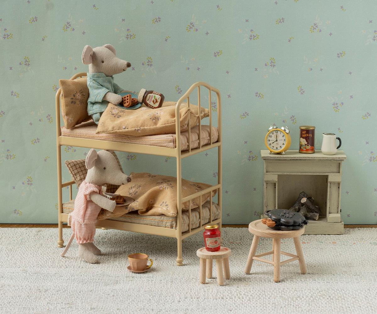 Maileg Bunk Bed with two toy mice in pajamas, pillows, and bedding.