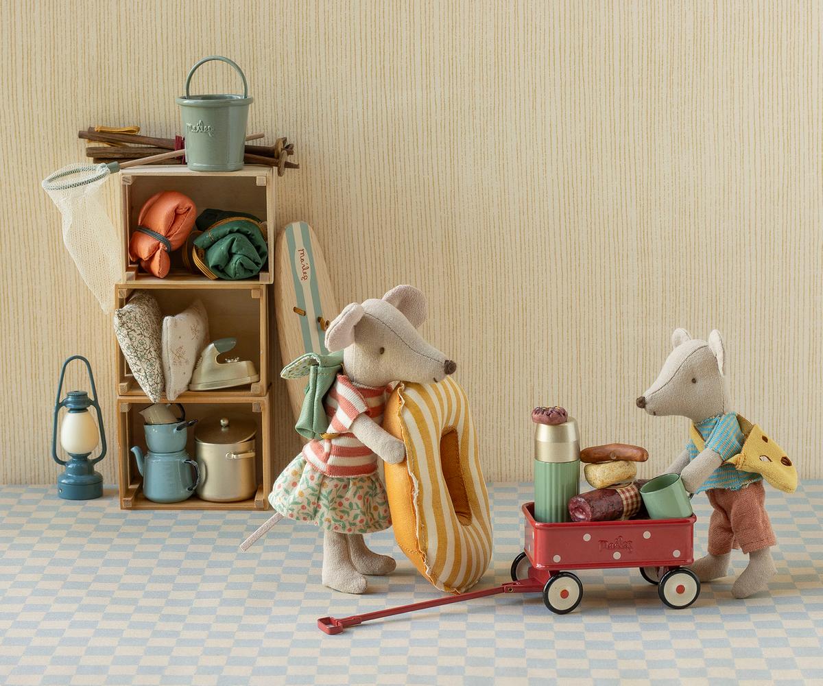 Dotted metal Maileg Wagon packed with miniature camping gear and two toy mice.