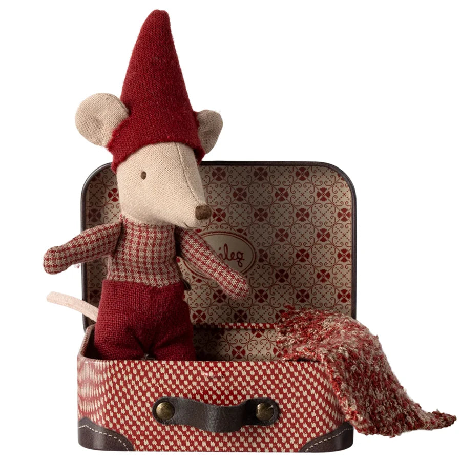 Maileg Christmas baby mouse in red outfit and hat, nestled in a patterned suitcase with a small blanket.