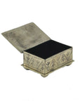 The J Alexander Rustic Silver 15-4-T Small Stamped Box w/ Turquoise is a rectangular, rustic silver box with engraved sides, open hinged lid, turquoise accent, and rounded feet—ideal for Southwestern home decor. Interior is dark and empty.