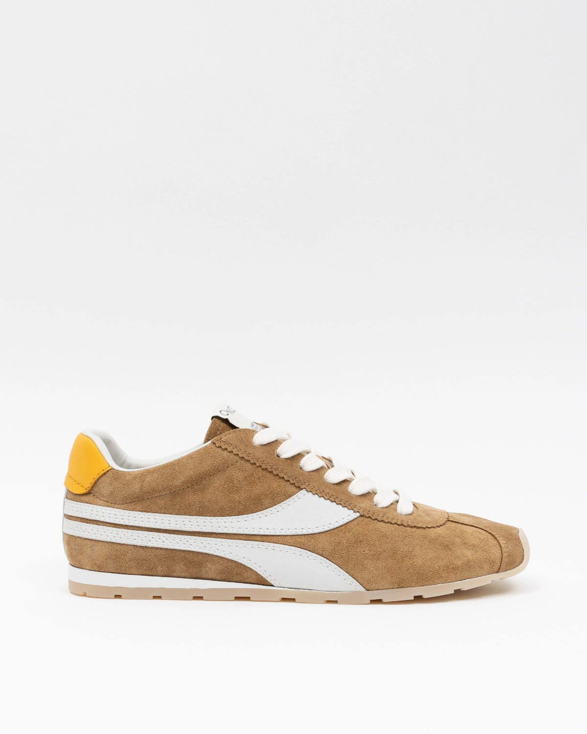 The Essex Sneaker by ONCEPT is an ultra-lightweight shoe in brown Italian calf suede with white accents, a white side stripe, white laces, and a yellow heel tab, shown on a plain white background.